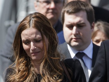 Children of former MP and media personality Jean Lapierre, Marie-Anne Lapierre, left, and her brother Jean Michel Lapierre, right, exit the funeral service for their father Jean Lapierre and his wife Nicole Beaulieu at at Saint-Viateur-d'Outremont church in Montrealon Saturday, April 16, 2016. The couple died on March 29 in an airplane crash along with Lapierre’s siblings Louis Lapierre, Marc Lapierre, and Martine Lapierre as well as pilots Pascal Gosselin and Fabrice Labourel. The group was heading to Les Iles-de-la-Madeleine for the funeral of their father Raymond Lapierre.