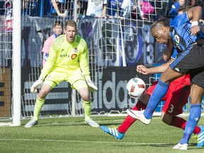 Toronto FC's Drew Moor stops a shot by Impact star Didier Drogba in front of goalkeeper Clint Irwin on April 23, 2016. The most effective part of Drogba's game against TFC was his post-up play and short layoffs to supporting players.