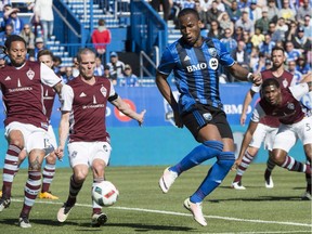 Montreal Impact forward Didier Drogba charges for the ball ahead of Colorado Rapids midfielder Jermaine Jones, left, and midfielder Sam Cronin during first half MLS action Saturday, April 30, 2016 in Montreal.