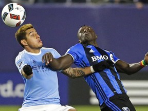 Montreal Impact's Dominic Oduro, right and New York City FC's Ronald Matarrita vie for the ball in the second half of an MLS soccer match Wednesday, April 27, 2016, at Yankee Stadium in New York.