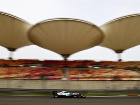 Nico Rosberg of Germany steers his Mercedes during practice at Shanghai International Circuit.