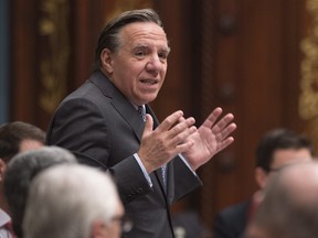 Quebec Second Opposition Leader François Legault gestures as he questions the government during question period, Thursday, February 25, 2016 at the legislature in Quebec City.