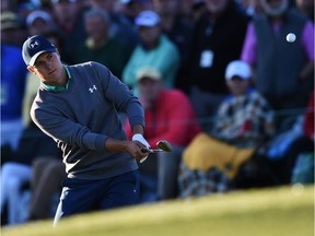 Jordan Spieth chips on the 17th green during Round 3 of the 80th Masters Golf Tournament at the Augusta National Golf Club on April 9, 2016, in Augusta, Ga.