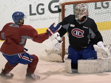 Centre Paul Byron tries recover to recover a rebound from Carey Price during a team practice at the Bell Sports Complex in Montreal on Monday, April 4, 2016.