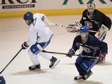 Left wing Max Pacioretty, left to right, leads Ryan Johnston  and goalie Charlie Lindgren during a team practice at the Bell Sports Complex in Montreal on Monday, April 4, 2016.