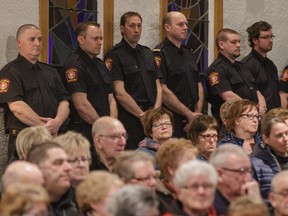 Firefighters and community members listen at a commemorative mass for the victims  of the March 29th airplane crash at Sainte-Madeleine de Havre-aux-Maisons church in Îles-de-la-Madeleine on Tuesday, April 5, 2016. Seven people were killed in the crash including former MP and political analyst Jean Lapierre, his wife Nicole Beaulieu, and  three of his siblings, Louis Lapierre, Marc Lapierre, and Martine Martine. Pilots Pascal Gosselin and Fabrice Labourel also died in the crash.