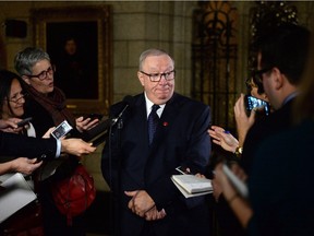 Senator Jacques Demers speaks to media in the foyer of the Senate on Parliament Hill in Ottawa on Dec. 3, 2015. Quebec senator and former Canadiens coach Jacques Demers has suffered a stroke.