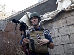 In this November 2012 file photo, posted on the website freejamesfoley.org, U.S. journalist James Foley is seen covering the civil war in Aleppo, Syria. A documentary airing on HBO Canada Monday night traces Foley's life and gruesome death.