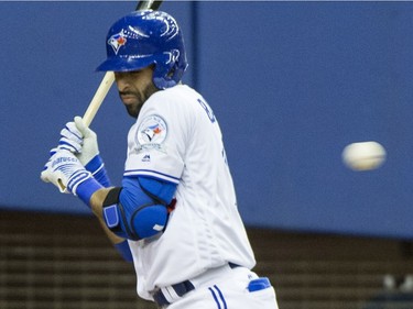 Toronto Blue Jays' Jose Bautista is hit by a pitch from Boston Red Sox starting pitcher Steven Wright during first inning spring training baseball game Friday, April 1, 2016, in Montreal.