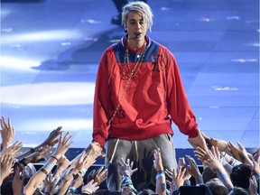 Justin Bieber, winner of awards for Best Male Artist and Dance Song of the Year, performs at iHeartRadio Music awards in Inglewood, Calif., on April 3.