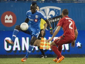 "I loved (Toronto) when I was there, but I love this city better," says Impact forward Dominic Oduro, eluding Toronto FC defender Justin Morrow on May 6, 2015, in Montreal.