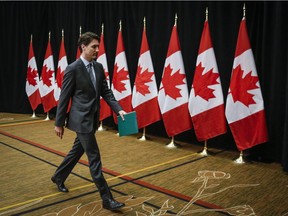 Prime Minister Justin Trudeau exits after making a statement to the media about the death of John Ridsdel.