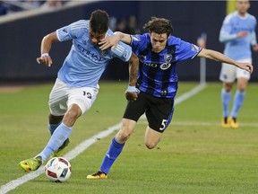 Montreal Impact's Maxim Tissot (51) defends New York City FC's Khiry Shelton (19) during the first half of an MLS soccer game, Wednesday, April 27, 2016, at Yankee Stadium in New York.