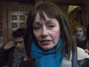 Lucy DeCoutere leaves the Toronto courthouse following the reading of the verdict in the Jian Ghomeshi sexual assault trial on Thursday, March 24, 2016. DeCoutere says she has resigned from the "Trailer Park Boys" just hours after one of its principal actors denied assaulting a woman in the U.S.