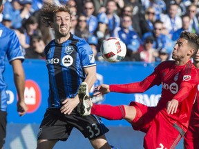 NYC FC's Andre Pirlo is "the best midfielder in the world because of his technique, his way to play," says Impact's Marco Donadel, battling TFC's Jonathan Osorio on April 23, 2016, at Saputo Stadium.