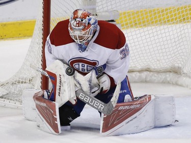 Montreal Canadiens goalie Mike Condon makes a save during the first period of an NHL hockey game against the Florida Panthers, Saturday, April 2, 2016, in Sunrise, Fla.
