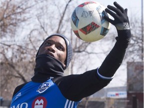 Montreal Impact striker Didier Drogba catches a ball during the team's practice Friday, April 15, 2016 in Montreal.