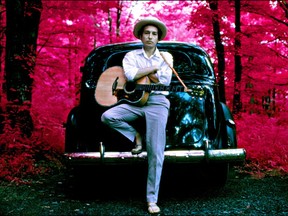 Bob Dylan, outside his Byrdcliff home, infrared color film, Woodstock, N.Y., 1968. Barney Hoskyns notes that "the Dylan who settled and hid away in Woodstock was the ultimate anti-hippie. He wanted a normal life, to be a dad. He wanted a white picket fence.”