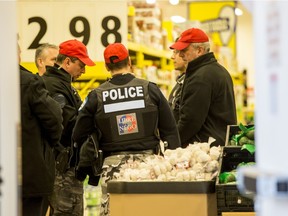 Police officers inside the Maxi Store at the corner of  Cremazie Blvd. and Papineau Ave. on Monday April 11, 2016, in Montreal. Clémence Beaulieu-Patry was stabbed Sunday night at the store and has died.