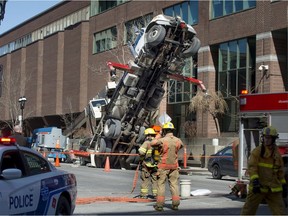 A father and son team was working roughly five storeys high when the crane holding their steel basket aloft tipped over, police say.