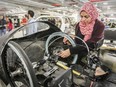 MONTREAL, QUE.: APRIL 11, 2016 -- Team coordinator Rim Hamila talks about modifications to the steering mechanism on Concordia University's entry in this year's Shell Ecomarathon, in Montreal Monday April 11, 2016. (John Mahoney} / MONTREAL GAZETTE)