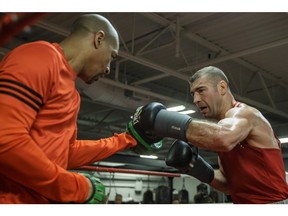 Montreal's Lucian Bute, right, takes part in a training session with his trainer Howard Grant this month.