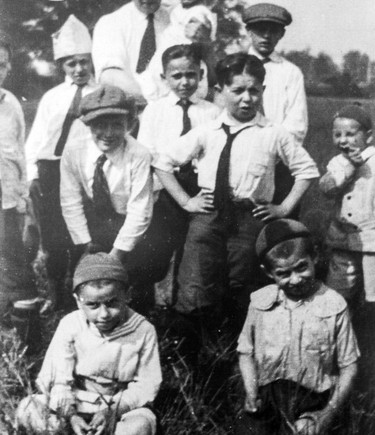 Children from the Montefiore Hebrew Orphans' Home in Montreal on a country outing, with staffer Alexander Rajinsky (rear, face not visible), 1924. Source: Myer and Judy Gordon Collection, Alex Dworkin Canadian Jewish Archives.