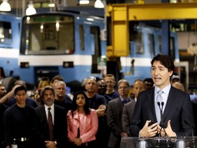 Justin Trudeau, Prime Minister of Canada, speaks with the employees and media as he announces a major investment in the STM. Trudeau spoke during a visit at the Hangar d'Youville STM repair centre in Montreal on Wednesday April 6, 2016. (Allen McInnis / MONTREAL GAZETTE)