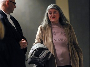 Vera Hirsh, right, a doctor treating Bernard Trépanier, one of the accused in the Contrecoeur trial who has cancer, walks to the courtroom in Montreal on April 6, 2016. The presiding judge will rule Thursday whether Trépanier should be tried separately from the co-accused because of his cancer treatments.