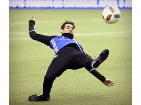 MONTREAL, QUE.: APRIL 8, 2016 -- Montreal Impact's Ignacio Piatti stretches out for a ball during practice at the Olympic Stadium in Montreal Friday April 8, 2016. ({John Mahoney} / MONTREAL GAZETTE)