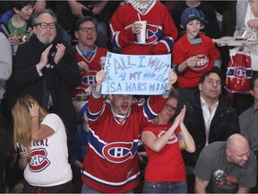 A Montreal Canadiens fan celebrates Dale Wiese's goal against the Buffalo Sabres during second period of National Hockey League game in Montreal on Wednesday, Feb. 3, 2016.