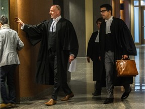 Lawyers enter the courtroom for the municipal corruption trial involving the sale of the city-owned Faubourg Contrecoeur land for a housing project, at the courthouse in Montreal, on Monday, February 8, 2016.