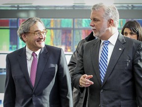Premier Philippe Couillard with Michael Sabia, who looked like a man who could do no wrong in the eyes of weary commuters and in a province starved for some good news.