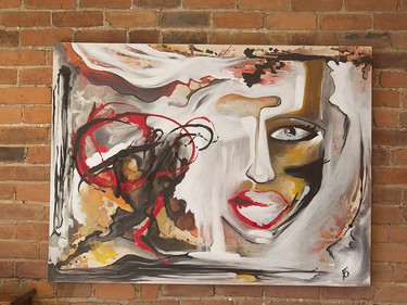 Artwork hanging on  exposed brick wall in the dining area. (Pierre Obendrauf / MONTREAL GAZETTE)