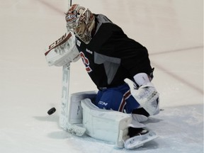 Canadiens goalie Carey Price takes shots from goaltending coach Stephane Waite before the start of a team practice at the Bell Sports Complex in Montreal on March 7, 2016.