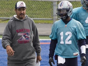 Alouettes offensive-coordinator Anthony Calvillo, left, with quarterback Rakeem Cato during practice last season, is overhauling the team's playbook for this season.