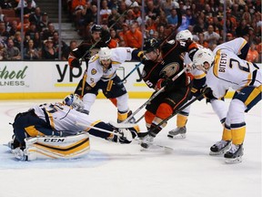 Goaltender Pekka Rinne of the Nashville Predators pokes the puck away from Sami Vatanen of the Anaheim Ducks in the third period of Game Five of the Western Conference First Round during the 2016 NHL Stanley Cup Playoffs at Honda Center on April 23, 2016, in Anaheim. The Ducks defeated the Predators 5-2.