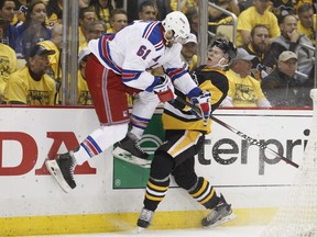 Rick Nash of the New York Rangers and Olli Maatta of the Pittsburgh Penguins collide in the first period in Game Five of the Eastern Conference First Round during the 2016 NHL Stanley Cup Playoffs at Consol Energy Center on April 23, 2016, in Pittsburgh.