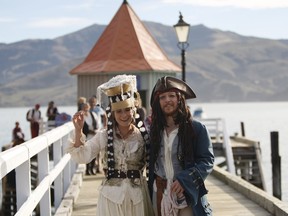 Bride Marianna Fenn and bridegroom Toby Ricketts stand on a jetty in Akaroa harbor, New Zealand, Saturday, April 16, 2016. New Zealand hosted the world's first Pastafarian wedding, conducted by the Church of the Flying Spaghetti Monster. The group, which began in the U.S. as a protest against religion encroaching into public schools, has gained legitimacy in New Zealand, where authorities recently decided it can officiate weddings.