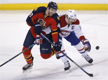 Florida Panthers centre Quinton Howden (42) and Montreal Canadiens left wing Max Pacioretty (67) battle for the puck during the second period of an NHL hockey game, Saturday, April 2, 2016, in Sunrise, Fla.