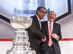 Nobody's laughing now: Former Rogers CEO Nadir Mohamed, left, and NHL commissioner Gary Bettman are all smiles during a news conference in Toronto in 2013 when they announced a $5.2-billion, 12-year agreement for National Hockey League games.
