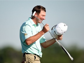 Jim Herman of the United States celebrates his victory on the 18th green during the final round of the Shell Houston Open at the Golf Club of Houston on April 3, 2016, in Humble, Tex.