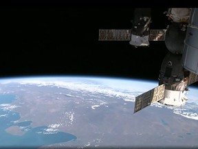 This August 12, 2014 NASA image from video taken by High Definition Earth Viewing (HDEV) experiment aboard the ISS, mounted on the External Payload Facility of the European Space Agencys Columbus module, shows the International Space Station(R) above the eastern coast of South America as it orbits the Earth. Europe's final robot cargo ship to the International Space Station (ISS) docked with its target as scheduled on Tuesday, in a precision manoeuvre webcast live. "Georges Lemaitre has completed the final docking of an automated transfer vehicle (ATV) to the ISS," mission commentator Rob Navias announced as the craft made contact at 1330 GMT as planned.