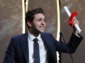 Canadian director Xavier Dolan delivers a speech after being awarded with the Grand prix for the film Juste La Fin Du Monde during the closing ceremony of the 69th Cannes Film Festival in Cannes, southern France, on May 22, 2016.