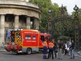 A fire truck is parked at the entrance to Monceau Park in the centre of Paris, Saturday, May 28, 2016, after a lightning bolt crashed down onto a Paris park, striking 11 people at a child's birthday party.