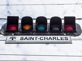 A white flashing light inside a red light helps get the attention of drivers who might not be expecting a traffic light.