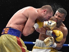 Badou Jack, right, exchanges blows with Montreal's Lucian Bute during their WBC Super Middleweight Boxing Championship in Washington, D.C., May 1, 2016.