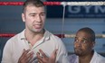 Boxer Lucian Bute, left, speaks to reporters in Montreal, Friday, May 27, 2016, as trainer Howard Grant looks on following Bute's positive test for a banned substance.