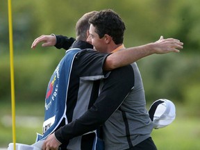 Northern Ireland's Rory McIlroy, right, celebrates winning the Irish Open with his caddie J.P. Fitzgerald.