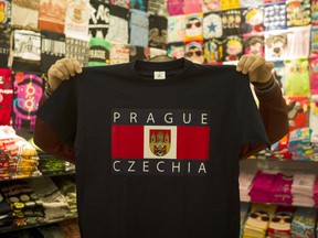 A vendor displays a t-shirt with the word "Czechia" in a store in Prague, Czech Republic, on April 27, 2016. The Czech Republic said it was tired of its long and unwieldy name and would like to be called "Czechia" from now on.